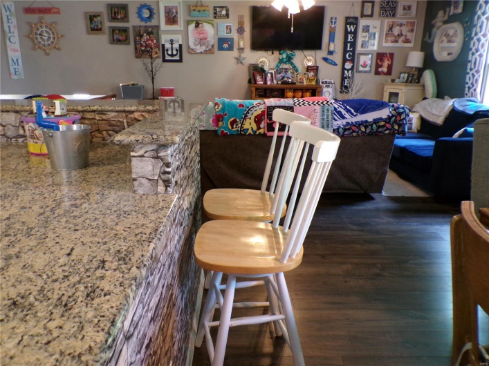 Breakfast Bar which joins the Dining room featuring seating for five.