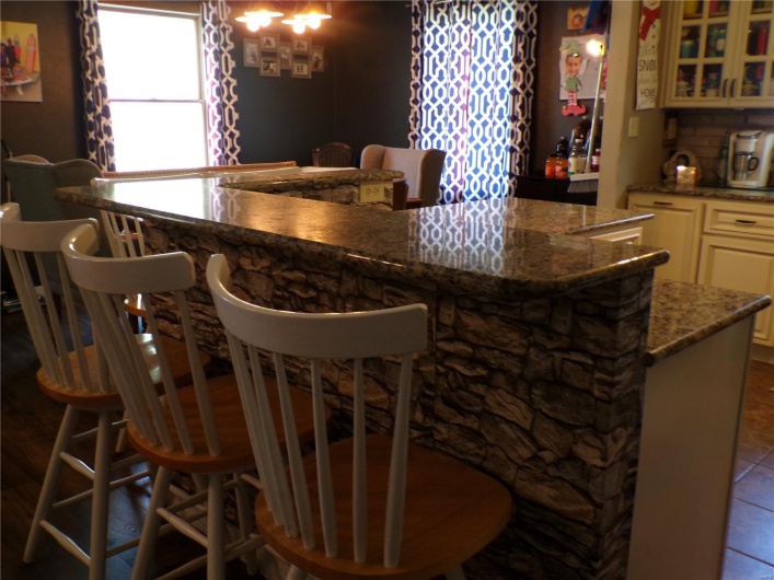 Breakfast bar with seating for 5 facing the Kitchen.