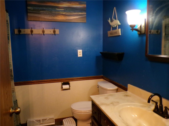 Full Bathroom with tub, shower, toilet and vanity
