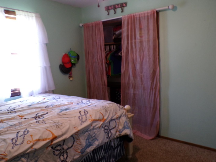 2nd view of Carpeted bedroom featuring a closet