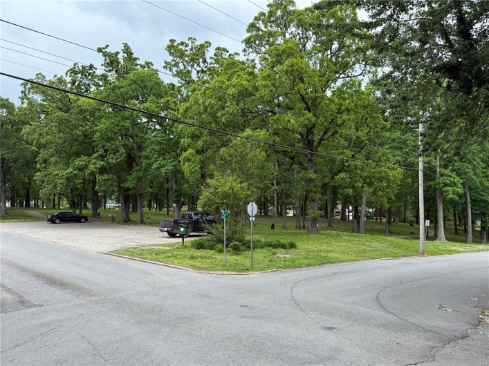 View of asphalt road featuring traffic signs