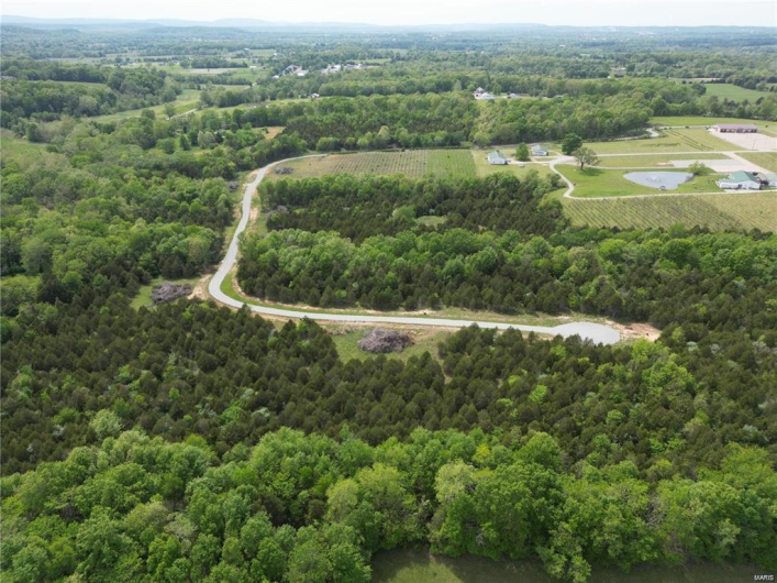 View of rural area with a heavily wooded area