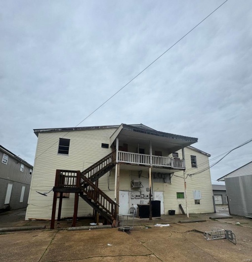 Back of house with stairway