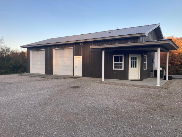 Front of 3 bay garage with front porch 
