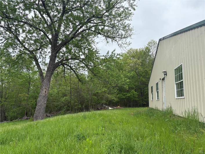 View of yard featuring a wooded view
