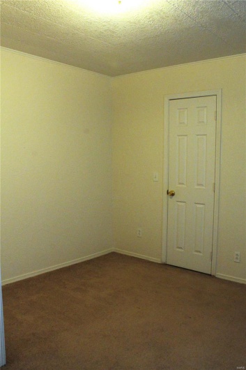 Unfurnished room with carpet floors and baseboards