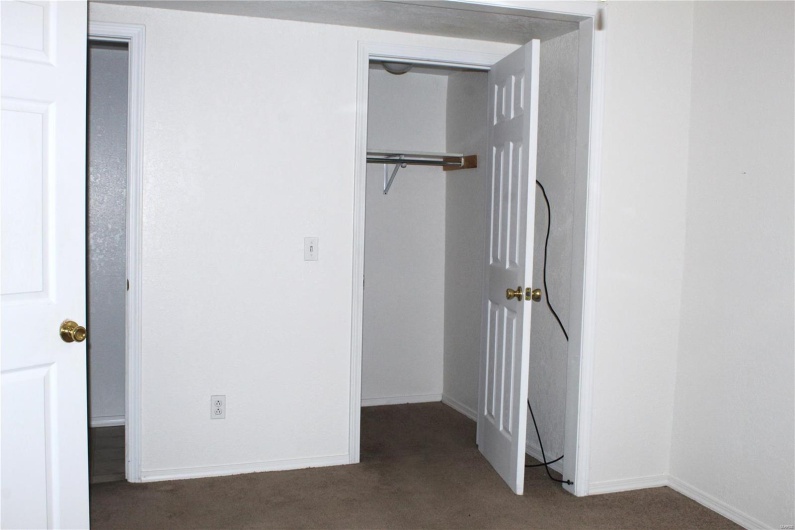 Unfurnished bedroom with baseboards, a closet, and carpet floors