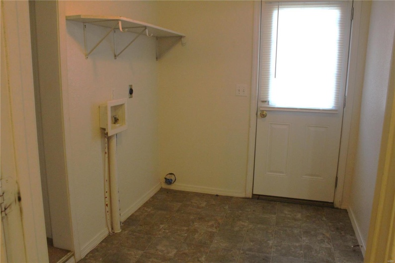 Laundry room with laundry area, baseboards, washer hookup, and electric dryer hookup