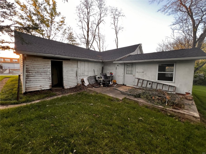 Back of house featuring a patio area and a yard