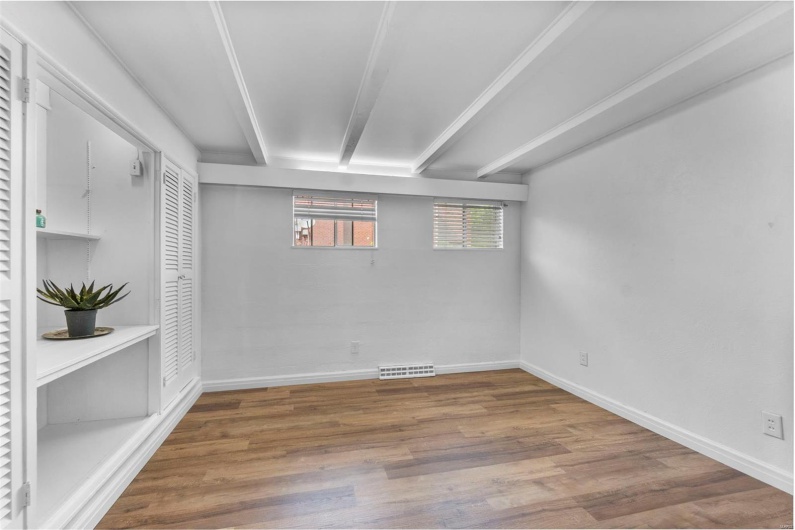 Below grade area with wood finished floors and baseboards