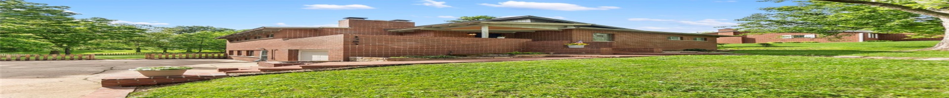 Residential For Sale View of front of home with brick siding, concrete driveway, an attached garage, and a chimney
