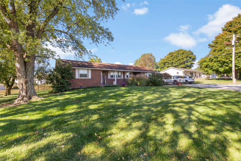 View of front of property with a front yard