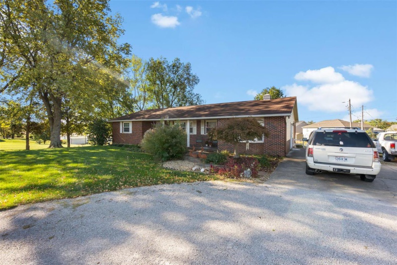 Single story home with a front yard