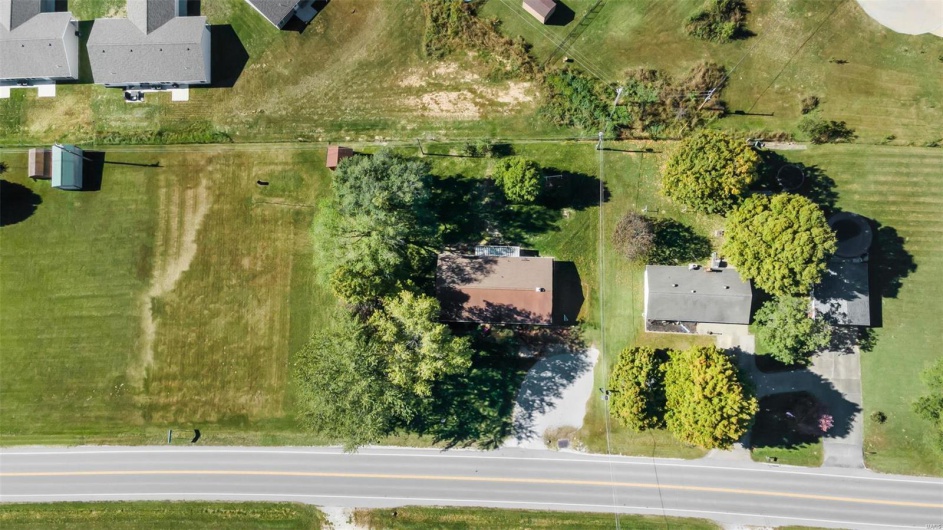 Birds eye view of property with a rural view