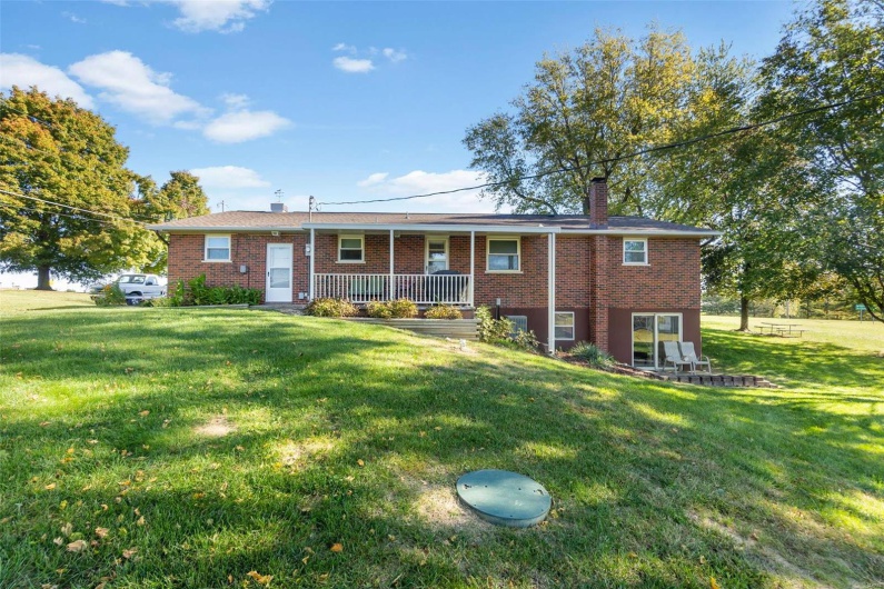 Ranch-style home with a front lawn