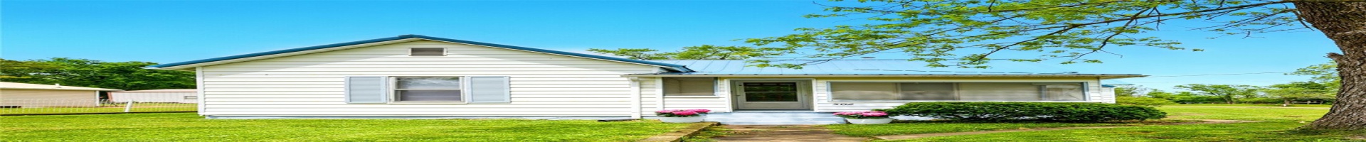 Residential For Sale View of front of home featuring a front yard and metal roof