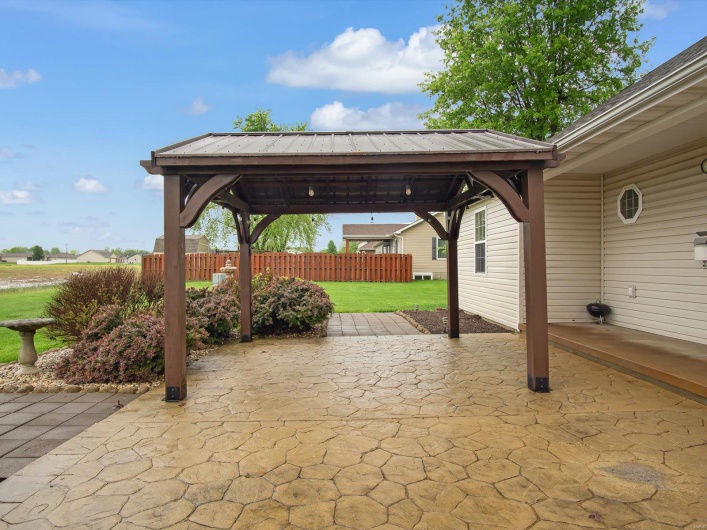 View of patio featuring a gazebo and fence
