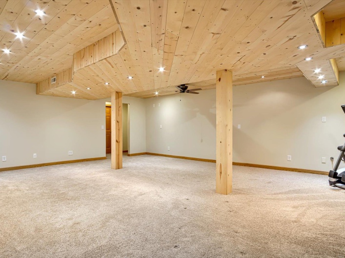 Finished below grade area with carpet floors, baseboards, wooden ceiling, and recessed lighting