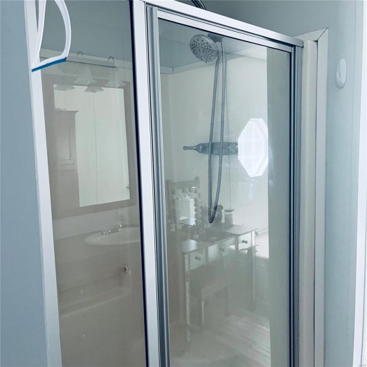 Bathroom featuring a shower stall