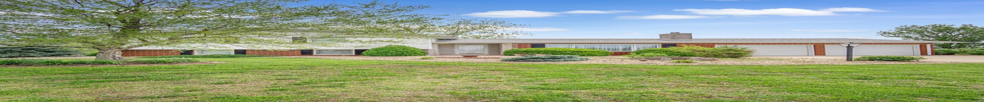 Residential For Sale View of front facade with a garage, brick siding, concrete driveway, and a front lawn