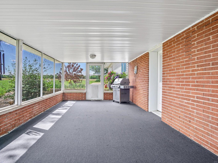 Unfurnished sunroom with healthy amount of natural light