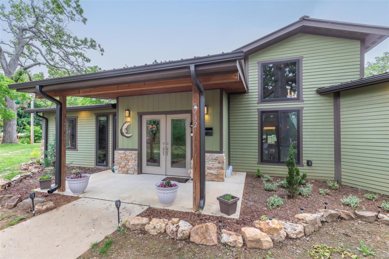 View of front of home featuring french doors and stone siding
