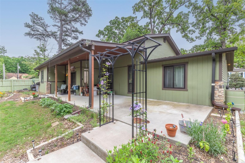 View of front facade featuring a patio area and fence
